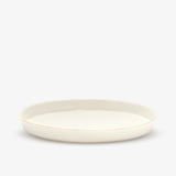 JINJIN PARIS Golden Rim Shallow Plate Large in ivory porcelain, side view with low profile and hand-finished gold rim.