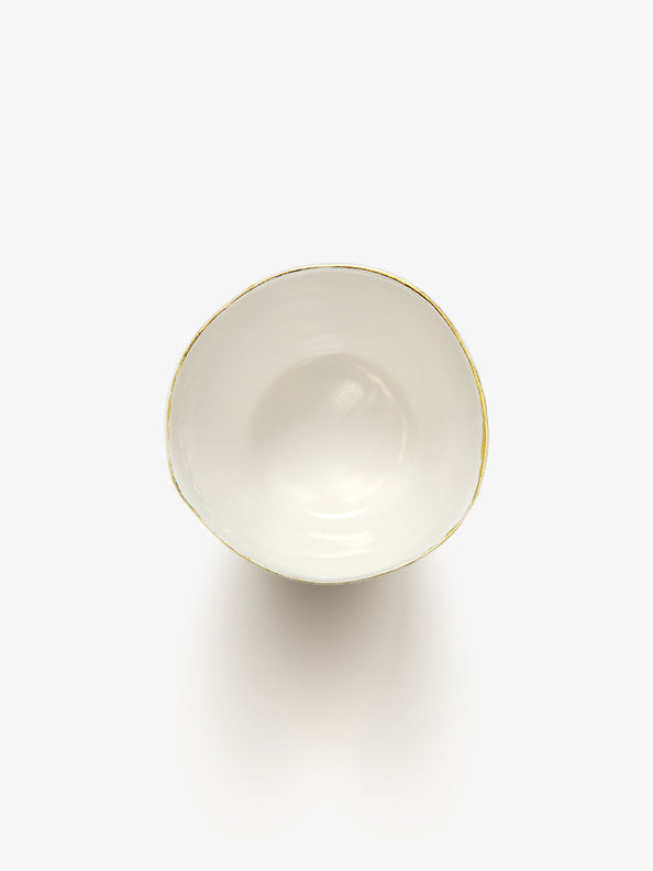 Top view of JINJIN PARIS Golden Rim Teacup Medium with glazed interior and asymmetrical circular opening.