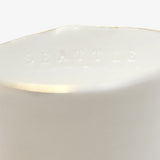 Detail of JINJIN PARIS Golden Rim Teacup Medium with subtle “SEATTLE” embossing along the interior rim.