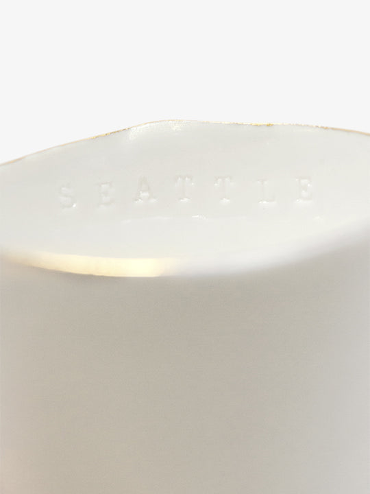 Detail of JINJIN PARIS Golden Rim Teacup Medium with subtle “SEATTLE” embossing along the interior rim.