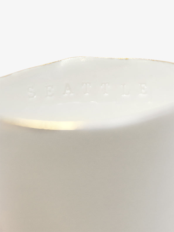 Detail of JINJIN PARIS Golden Rim Teacup Medium with subtle “SEATTLE” embossing along the interior rim.