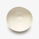 Top view of JINJIN PARIS Pure White Bowl in glazed ivory porcelain with asymmetrical circular shape.