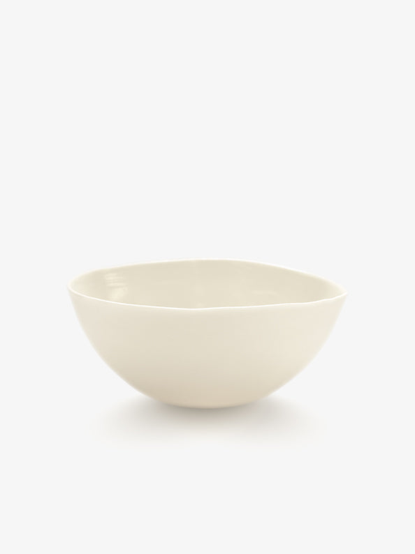 JINJIN PARIS Pure White Bowl in ivory porcelain, angled view with organic silhouette and softly irregular rim.