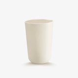 JINJIN PARIS Pure White Deep Cup in ivory porcelain, side view with organic silhouette and softly irregular rim.
