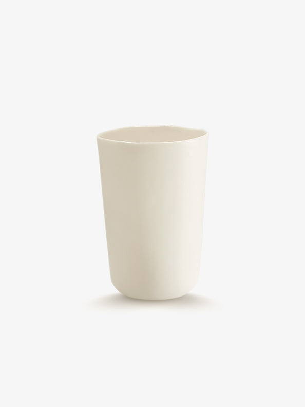 JINJIN PARIS Pure White Deep Cup in ivory porcelain, side view with organic silhouette and softly irregular rim.