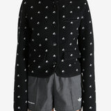 Black jacket worn by a person, showing the jacket fit