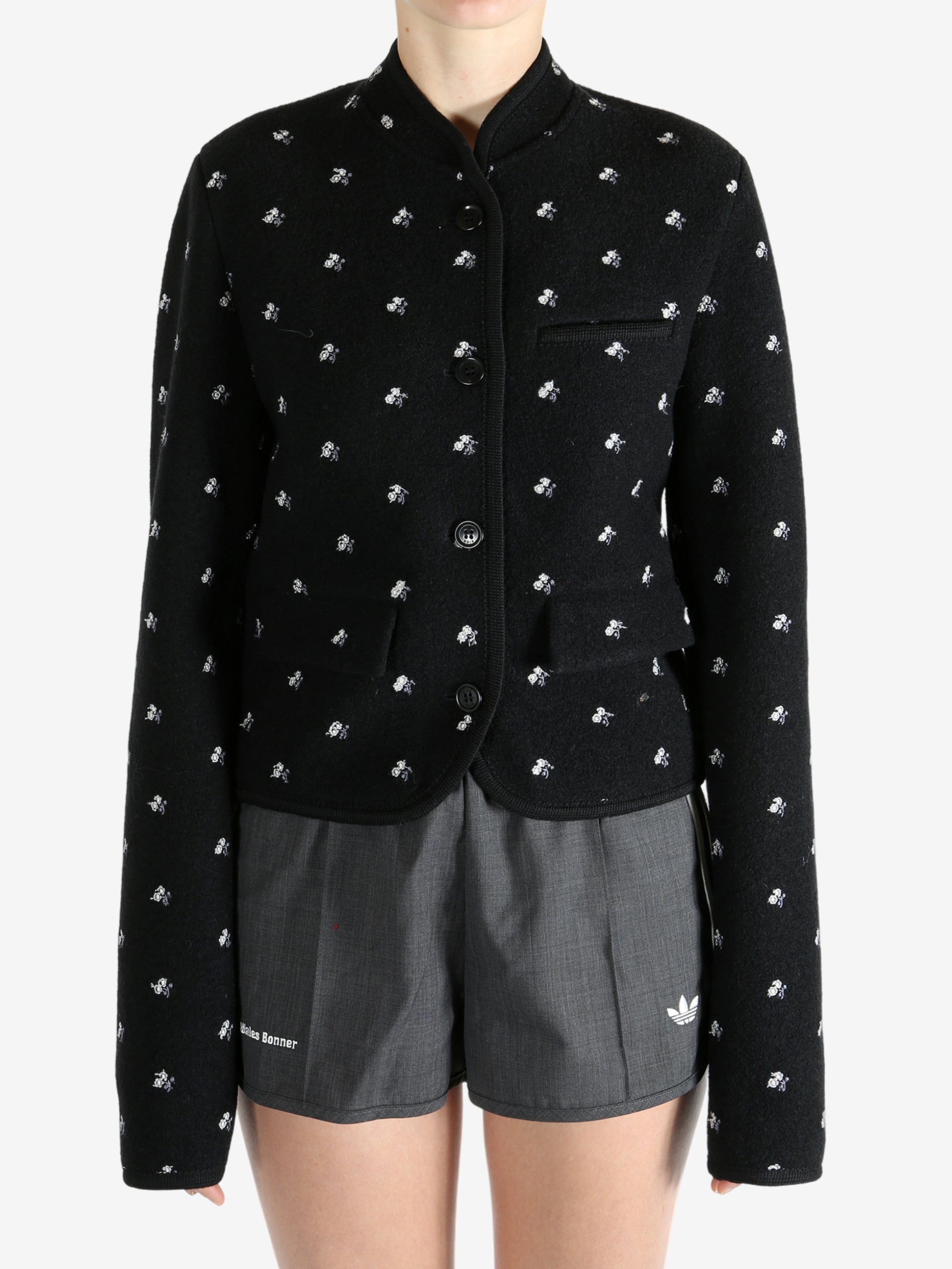 Black jacket worn by a person, showing the jacket fit