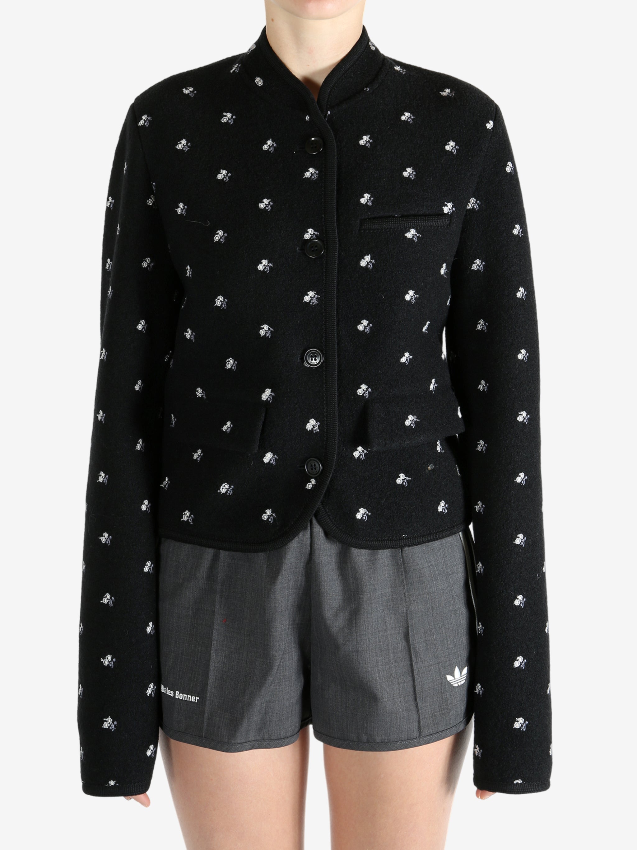 Black jacket worn by a person, showing the jacket fit