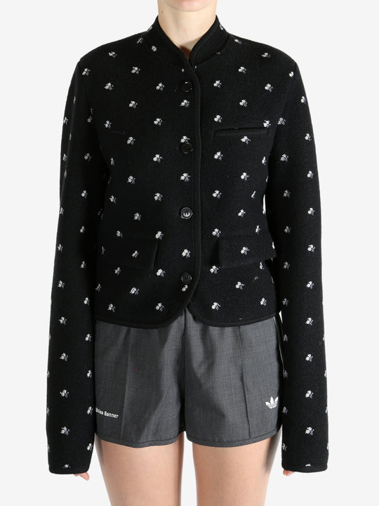 Black jacket worn by a person, showing the jacket fit