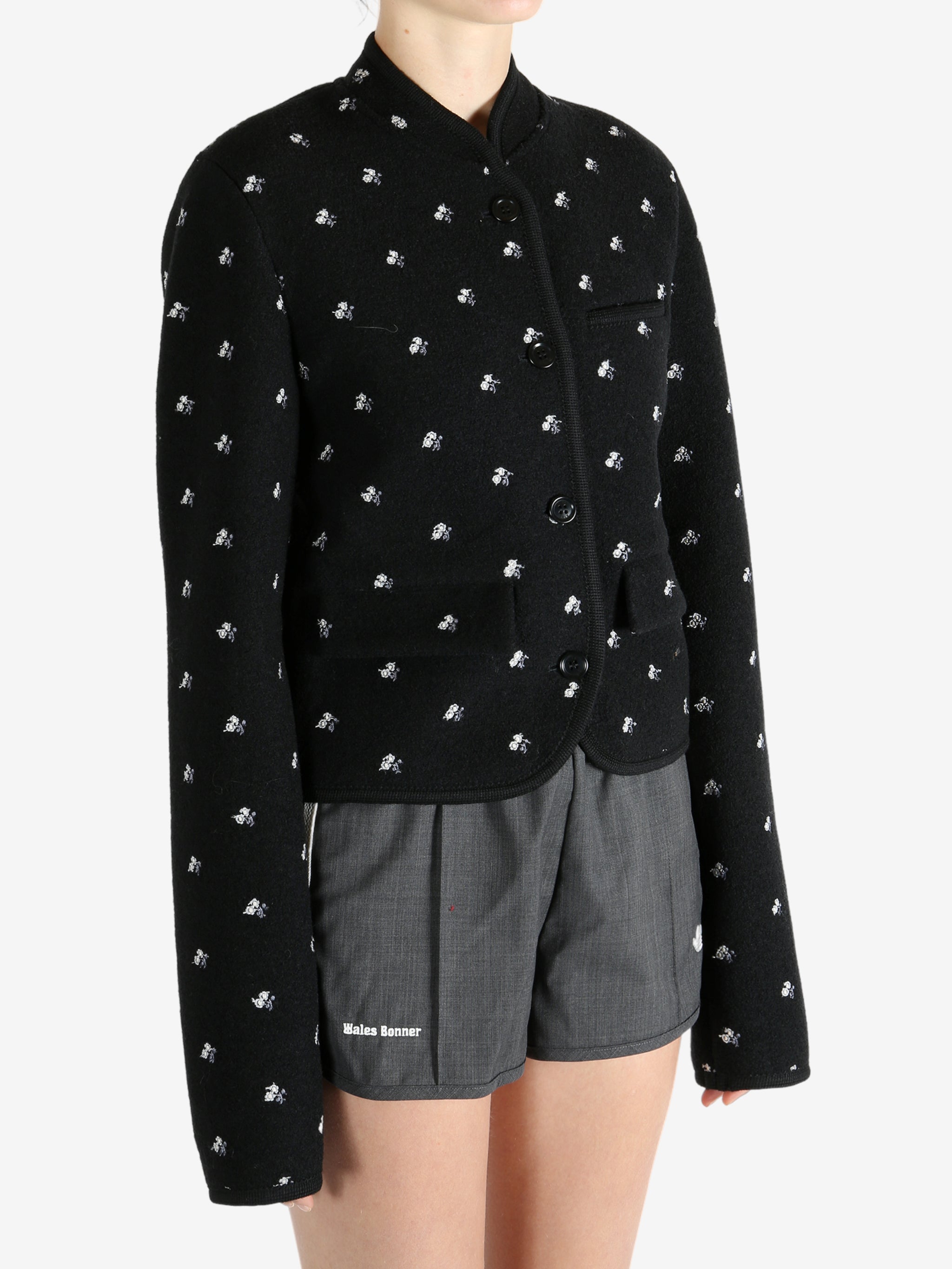 Black jacket worn by a person, showing the jacket fit