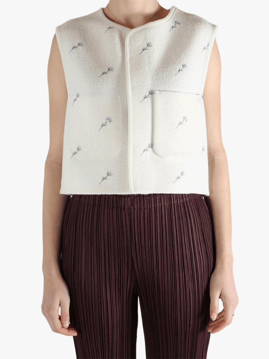 White jacket worn by a person, showing the jacket fit