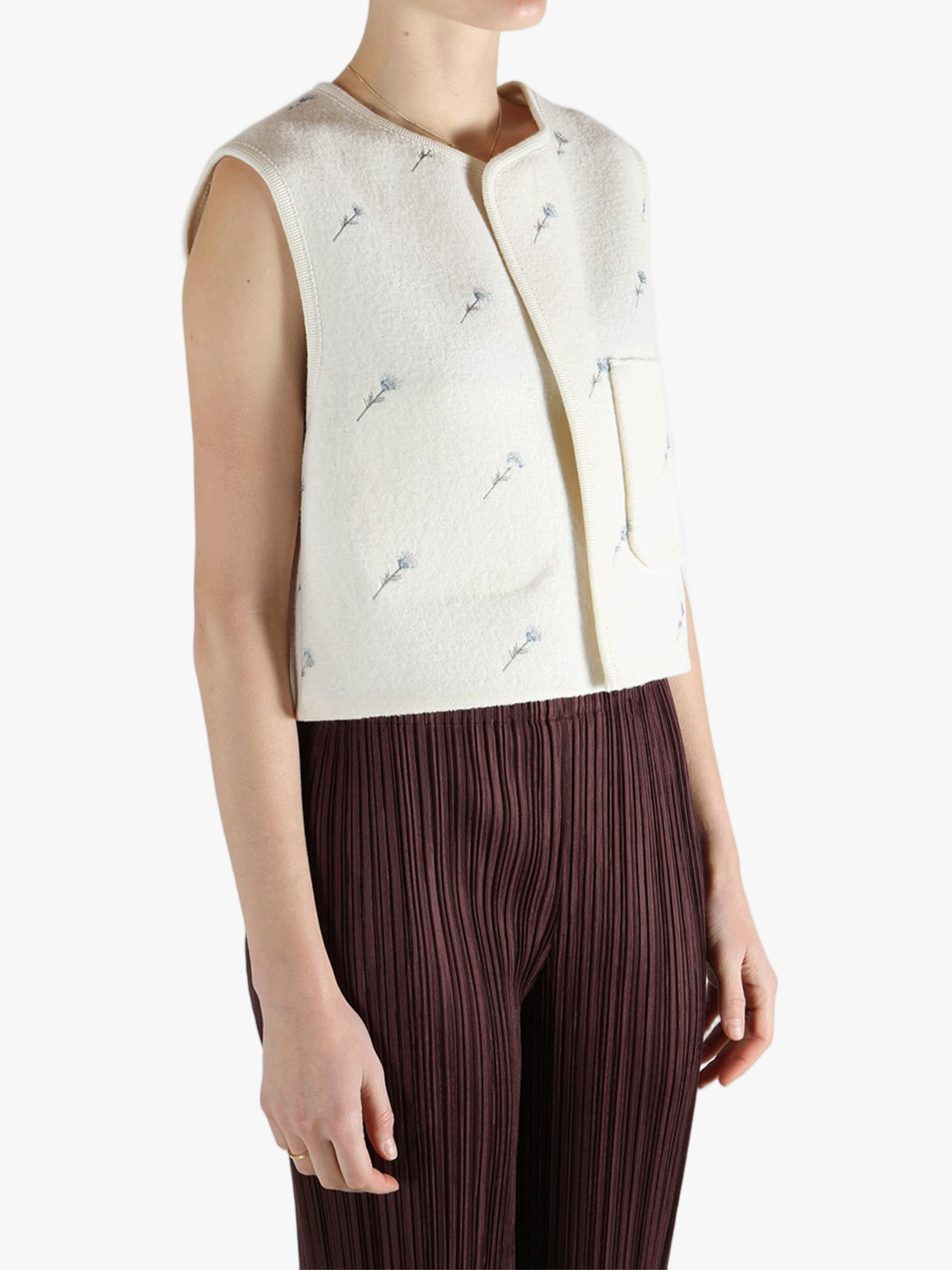 White jacket worn by a person, showing the jacket fit