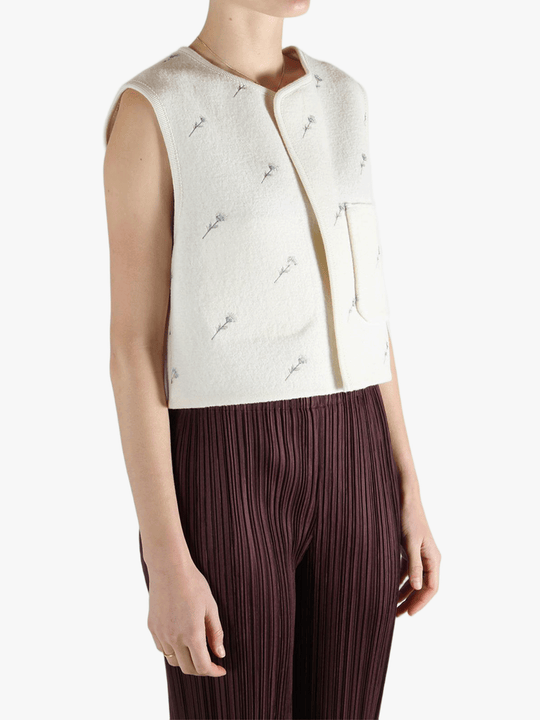 White jacket worn by a person, showing the jacket fit