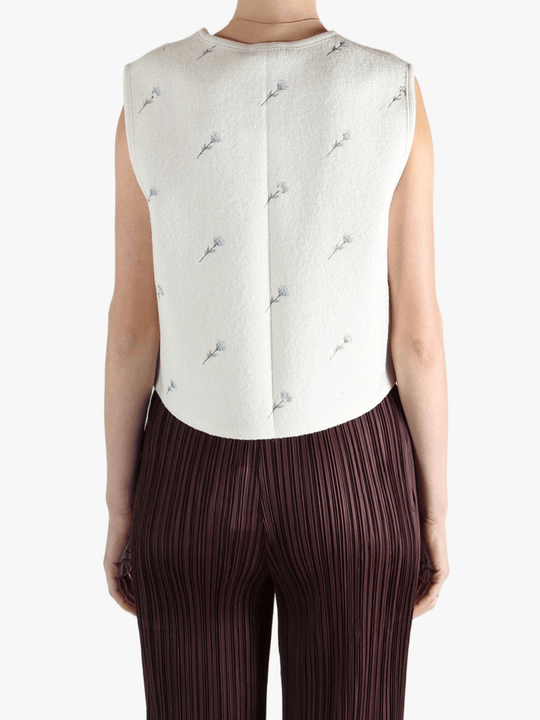 White jacket worn by a person, showing the jacket fit