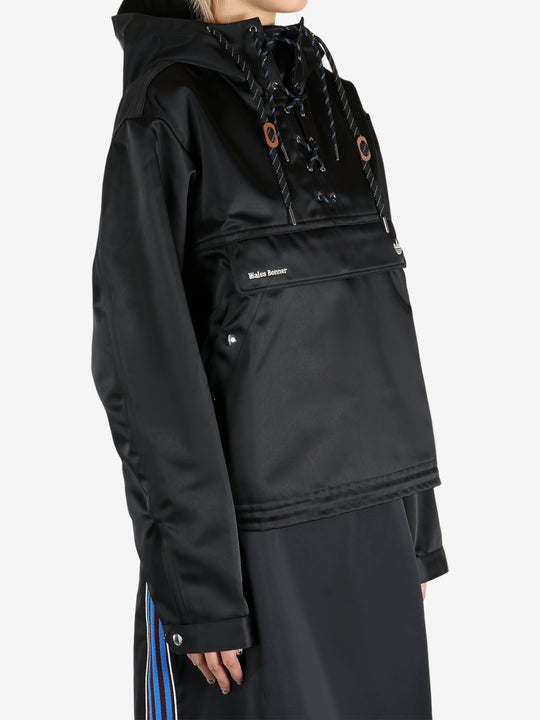 Black jacket worn by a person, showing the jacket's fit