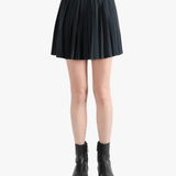 Black skirt,worn by a person, showing the skirt fit