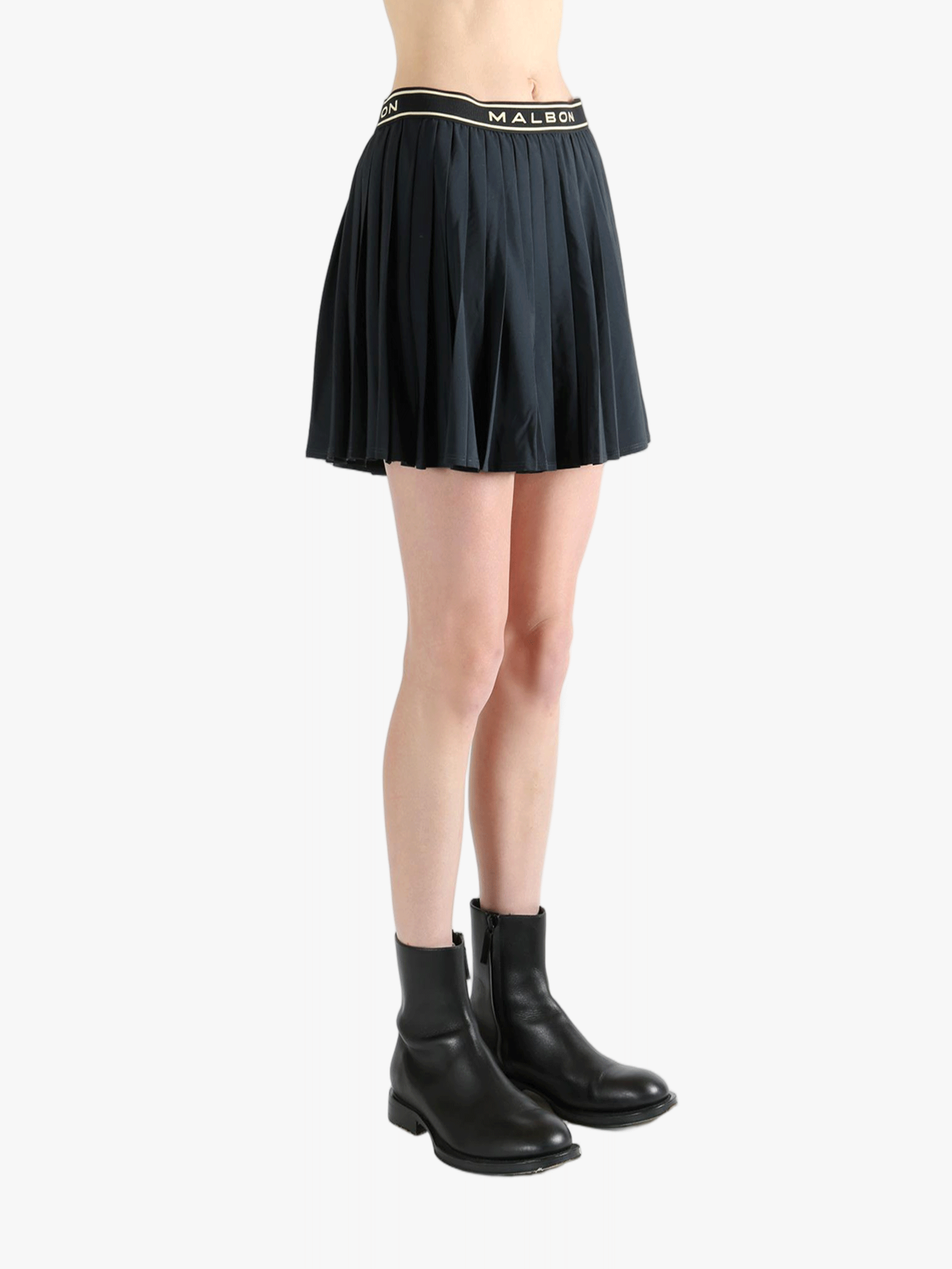 Black skirt,worn by a person, showing the skirt fit