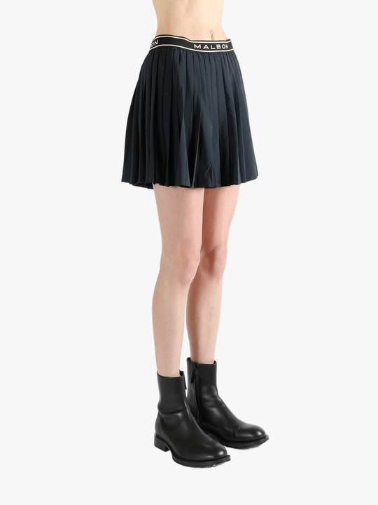 Black skirt,worn by a person, showing the skirt fit