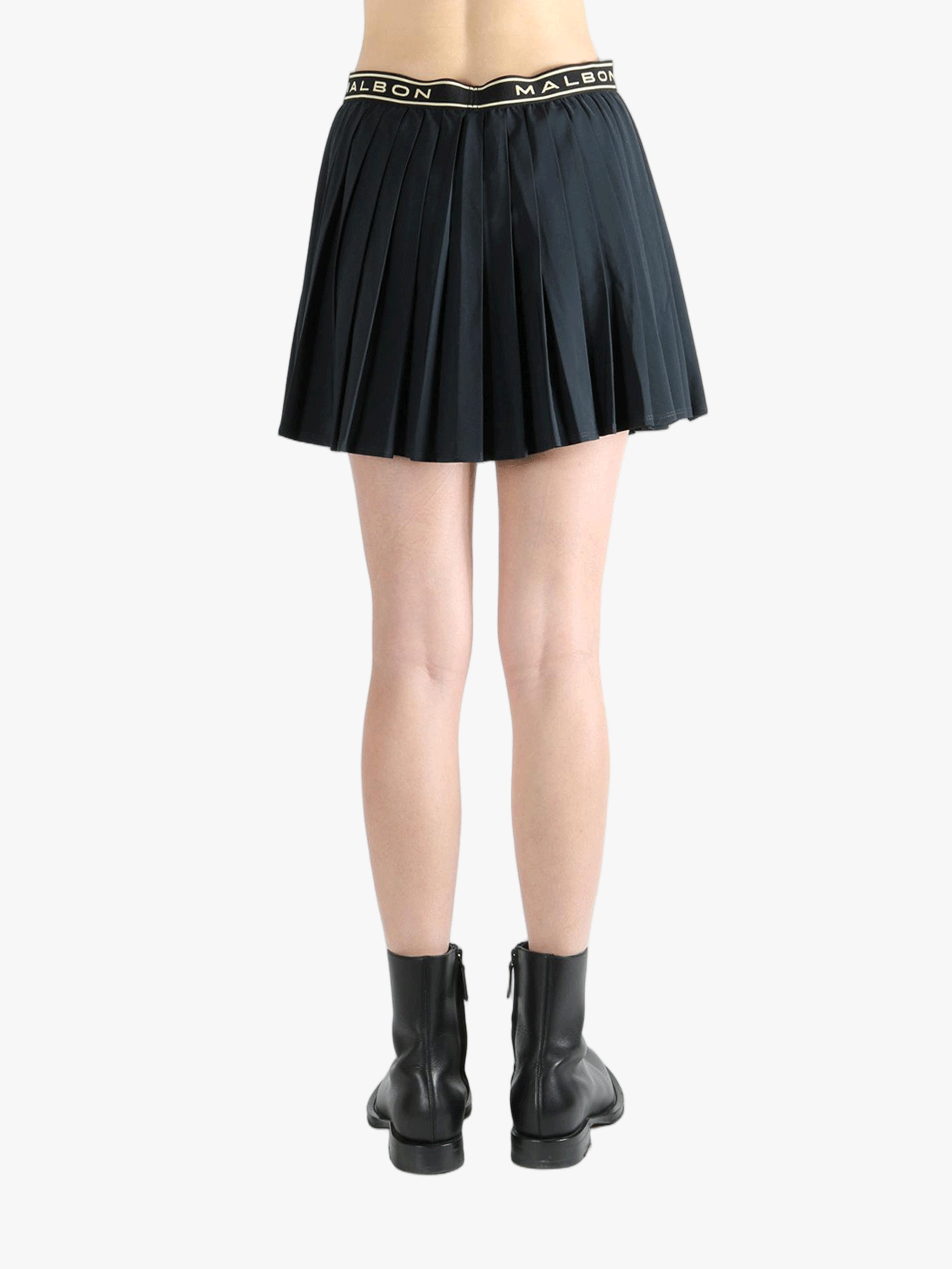 Black skirt,worn by a person, showing the skirt fit