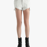 White shorts worn by a person, showing the shorts fit