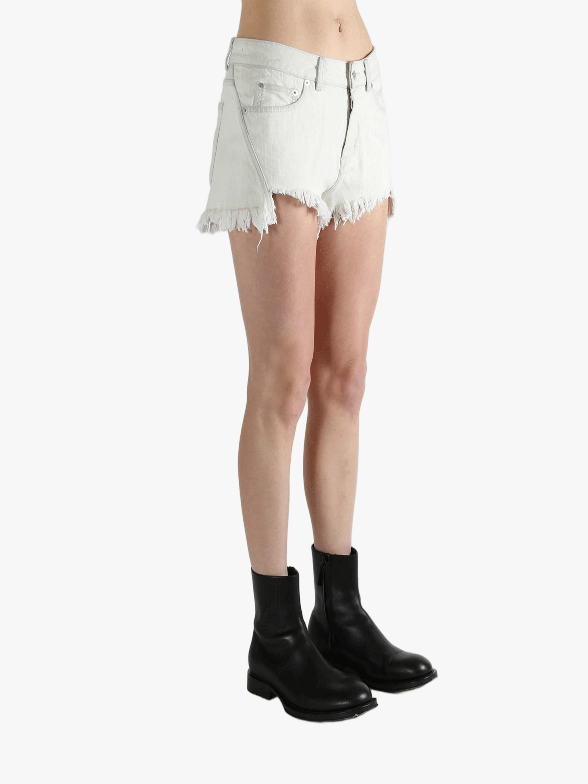 White shorts worn by a person, showing the shorts fit