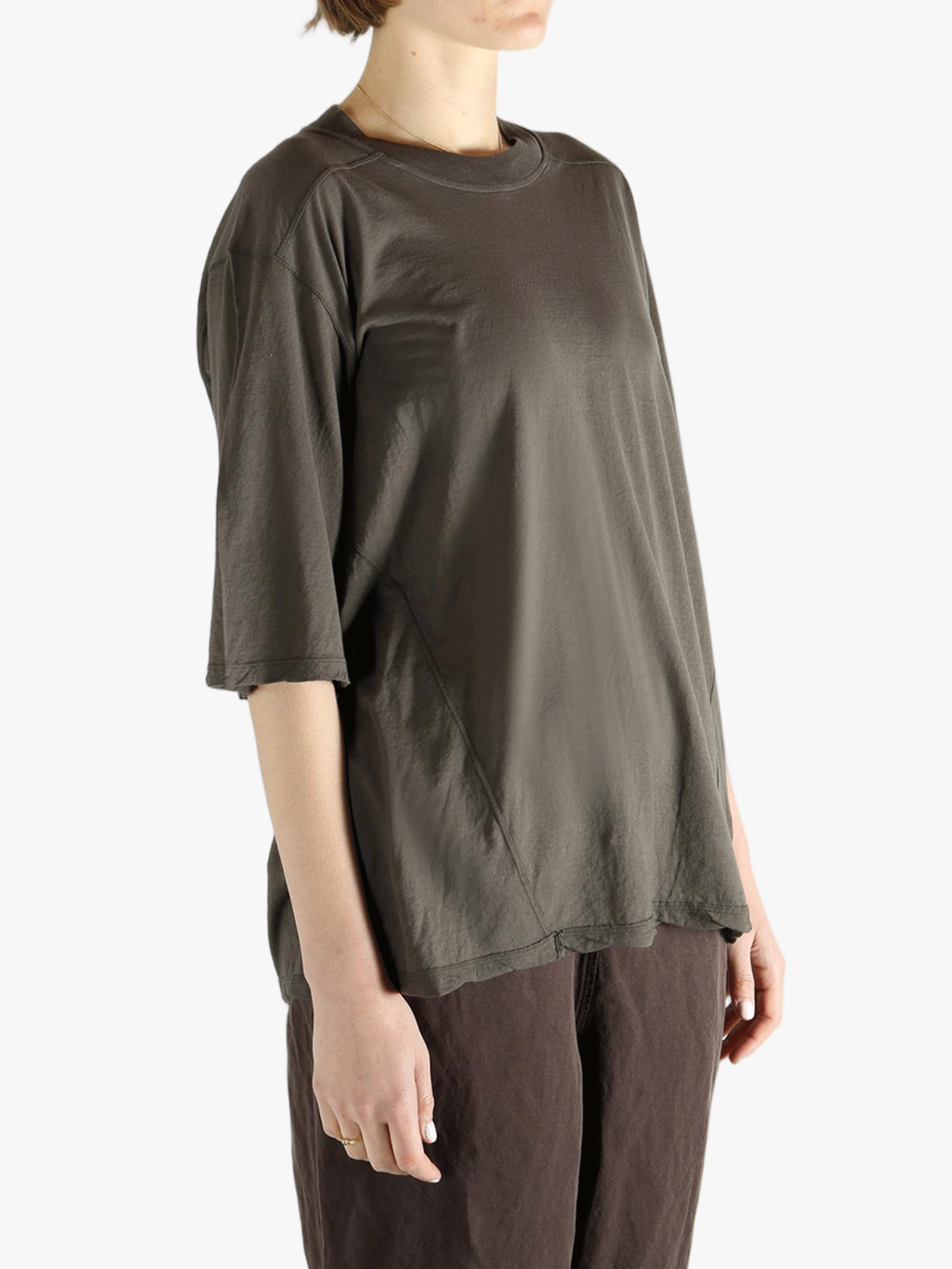 Grey T-shirt worn by a person, showing the T-shirt fit