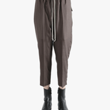 Brown pants worn by a person, showing the pants fit