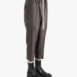 Brown pants worn by a person, showing the pants fit