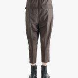 Brown pants worn by a person, showing the pants fit