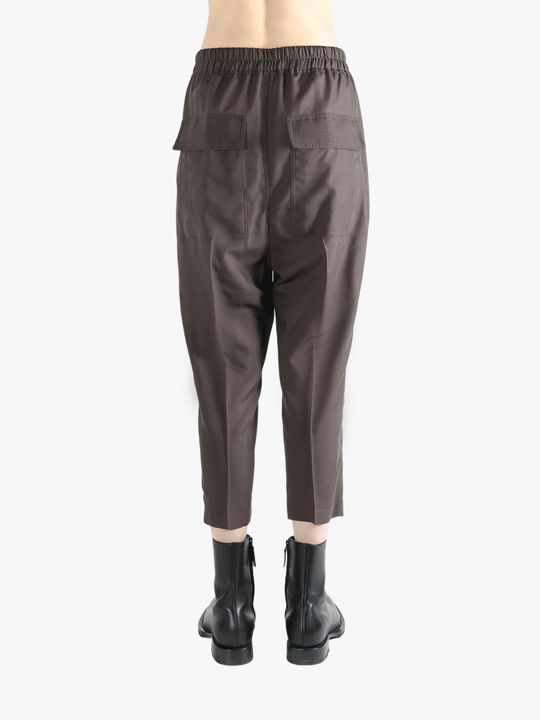 Brown pants worn by a person, showing the pants fit