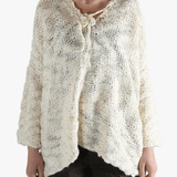 White tops worn by a person, showing the tops fit