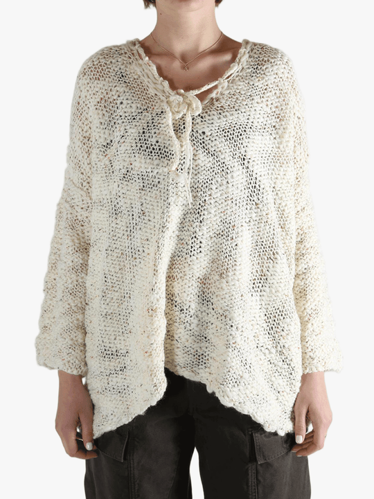 White tops worn by a person, showing the tops fit