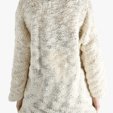 White tops worn by a person, showing the tops fit