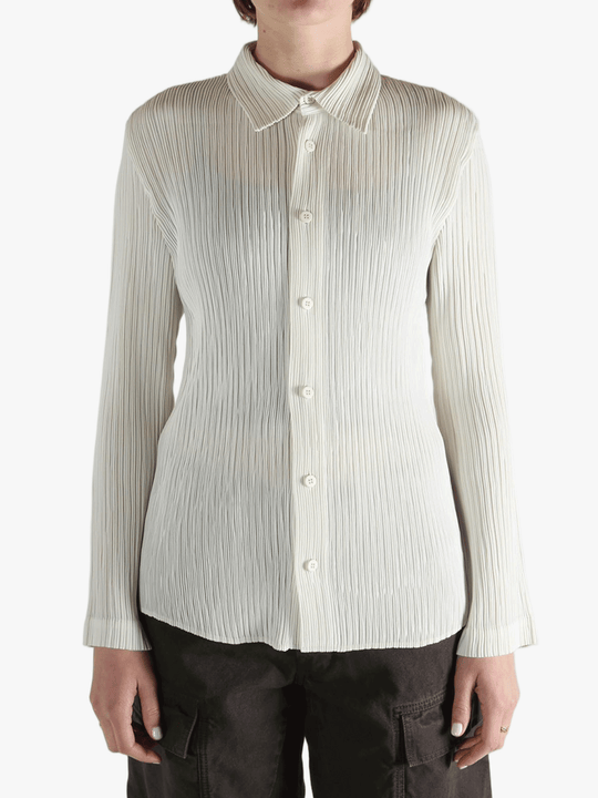 White shirt worn by a person, showing the shirt fit