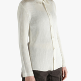 White shirt worn by a person, showing the shirt fit