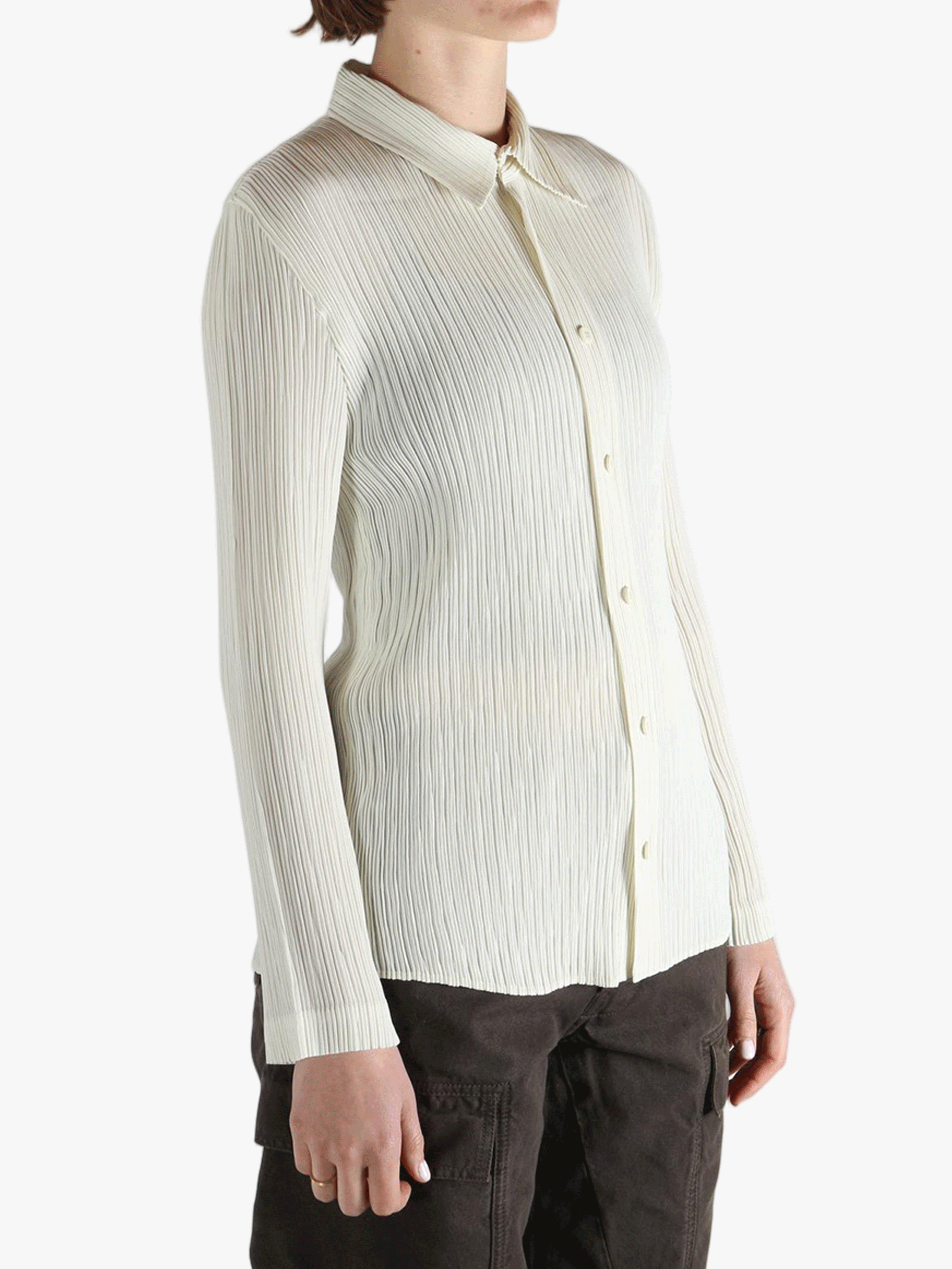 White shirt worn by a person, showing the shirt fit