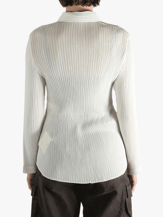 White shirt worn by a person, showing the shirt fit