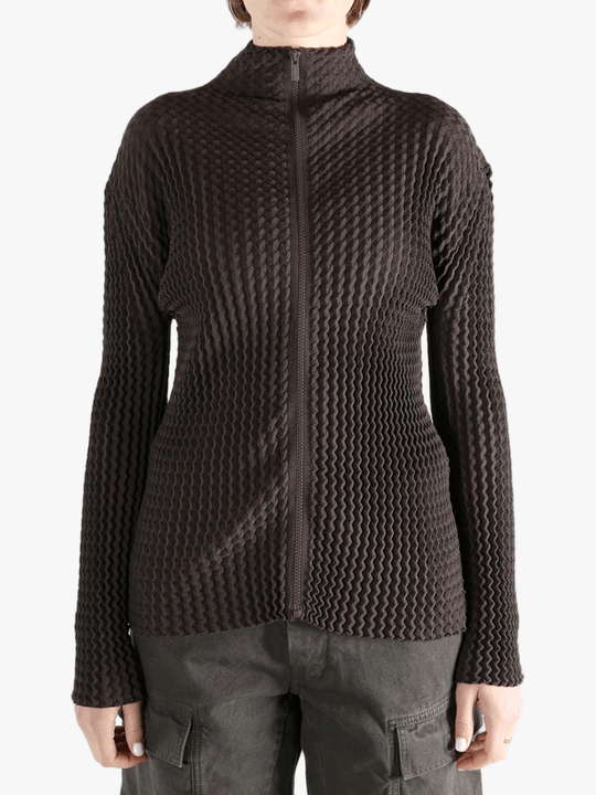 Brown jacket worn by a person, showing the jacket  fit