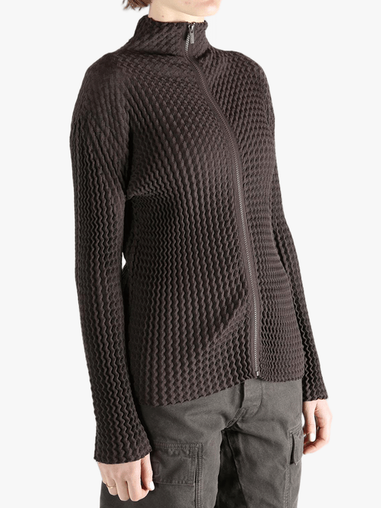 Brown jacket worn by a person, showing the jacket  fit