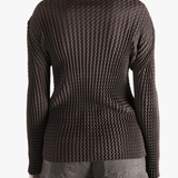 Brown jacket worn by a person, showing the jacket  fit