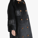 Black jacket worn by a person, showing the jacket fit