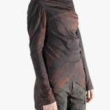 Red tops worn by a person, showing the tops fit