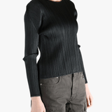 Black shirt worn by a person, showing the shirt fit