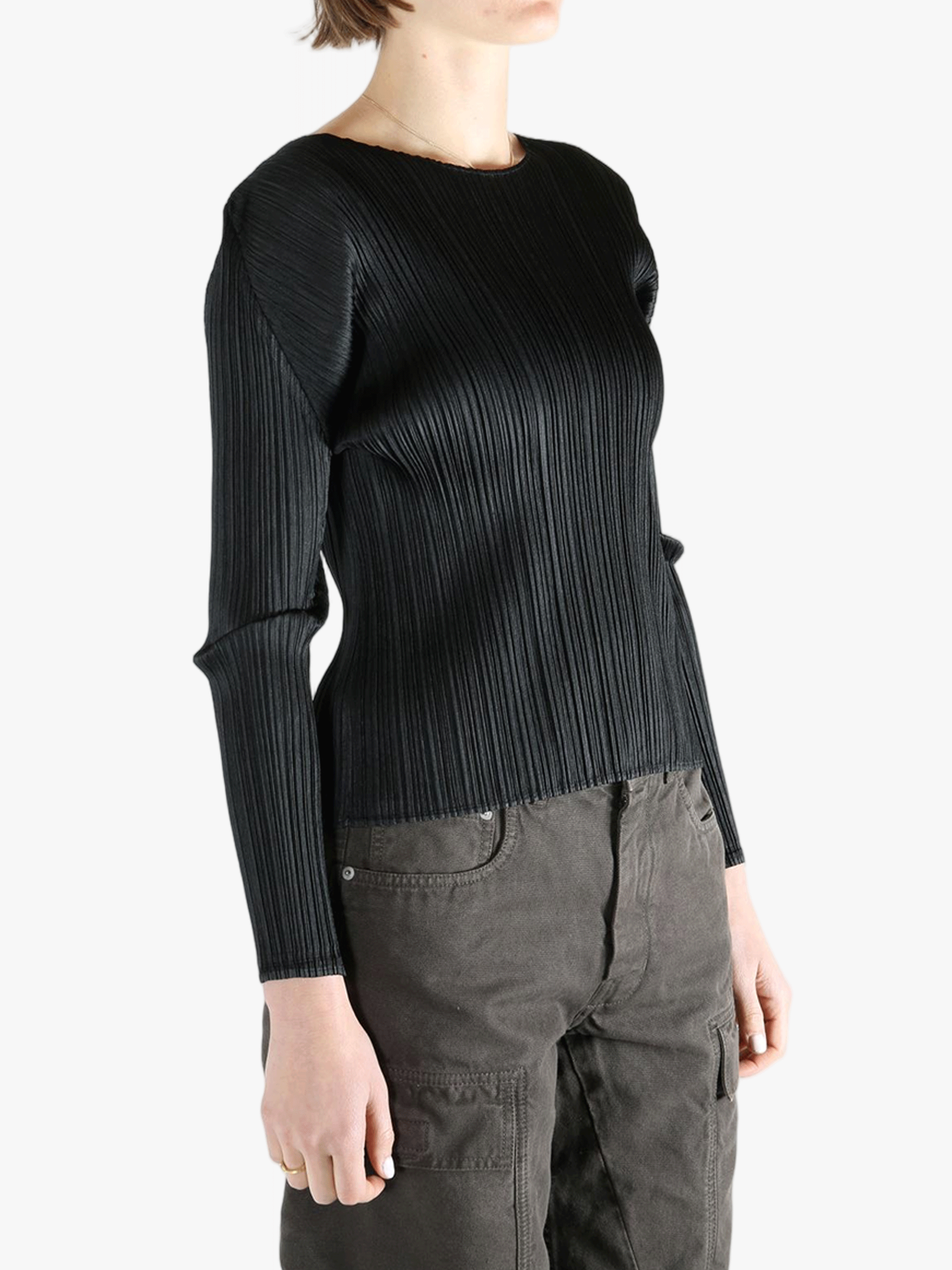 Black shirt worn by a person, showing the shirt fit