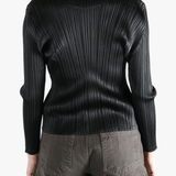 Black shirt worn by a person, showing the shirt fit