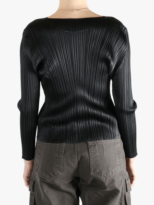 Black shirt worn by a person, showing the shirt fit