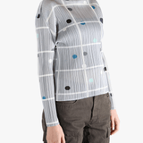 Grey shirt worn by a person, showing the shirt fit