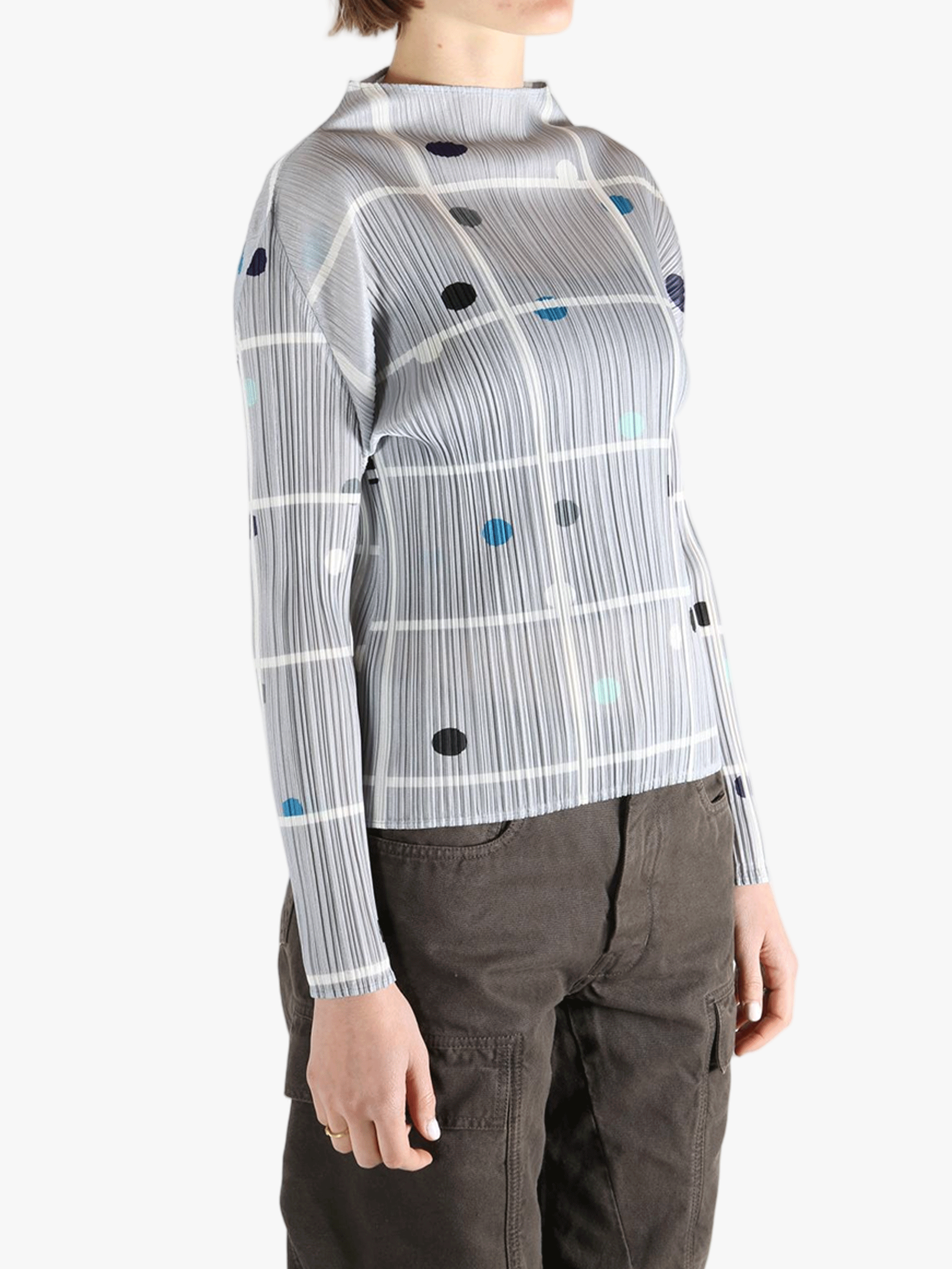 Grey shirt worn by a person, showing the shirt fit