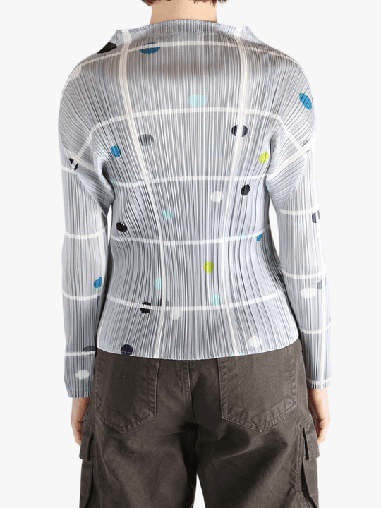 Grey shirt worn by a person, showing the shirt fit