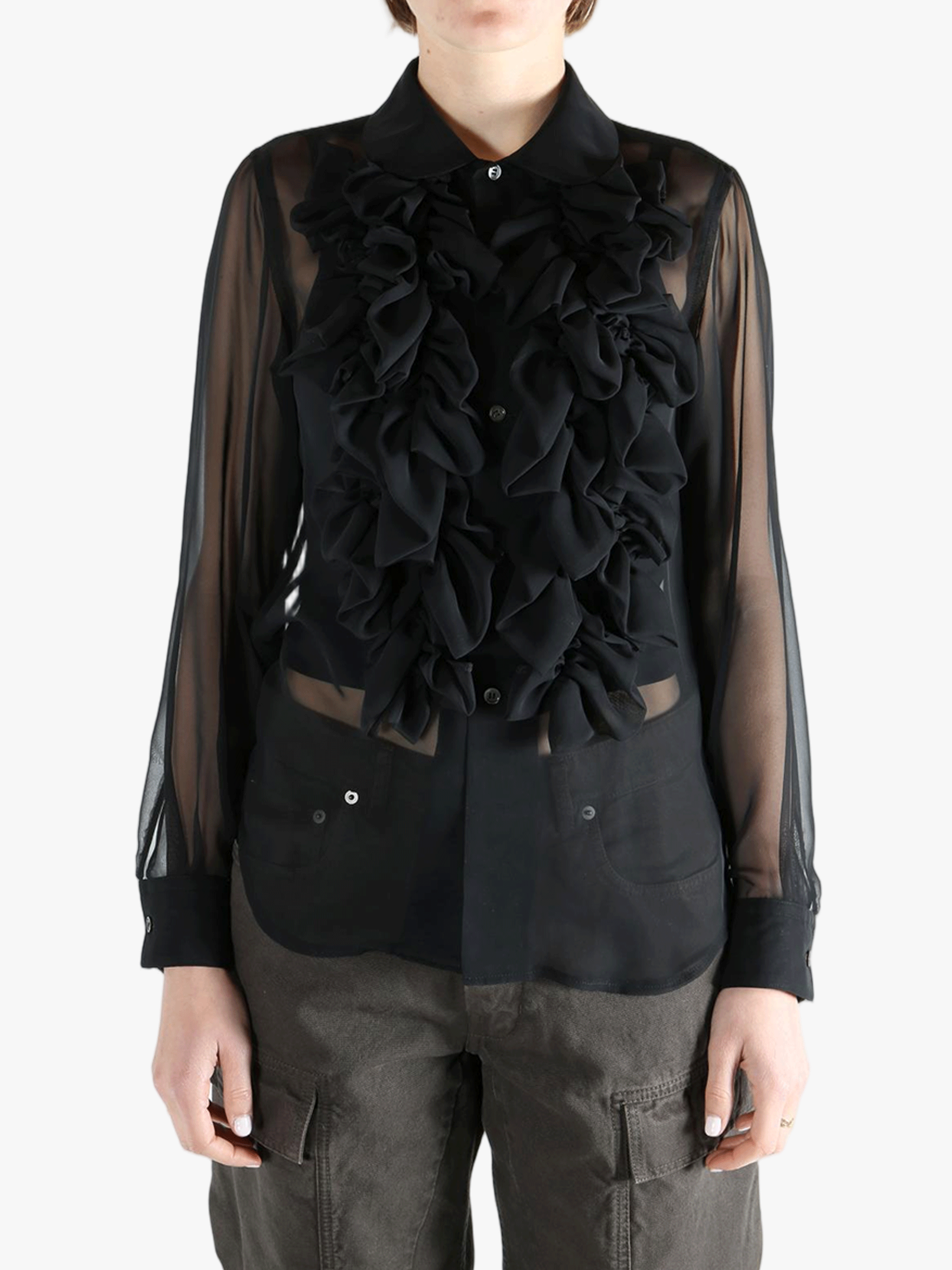 Black shirt  worn by a person, showing the shirt fit